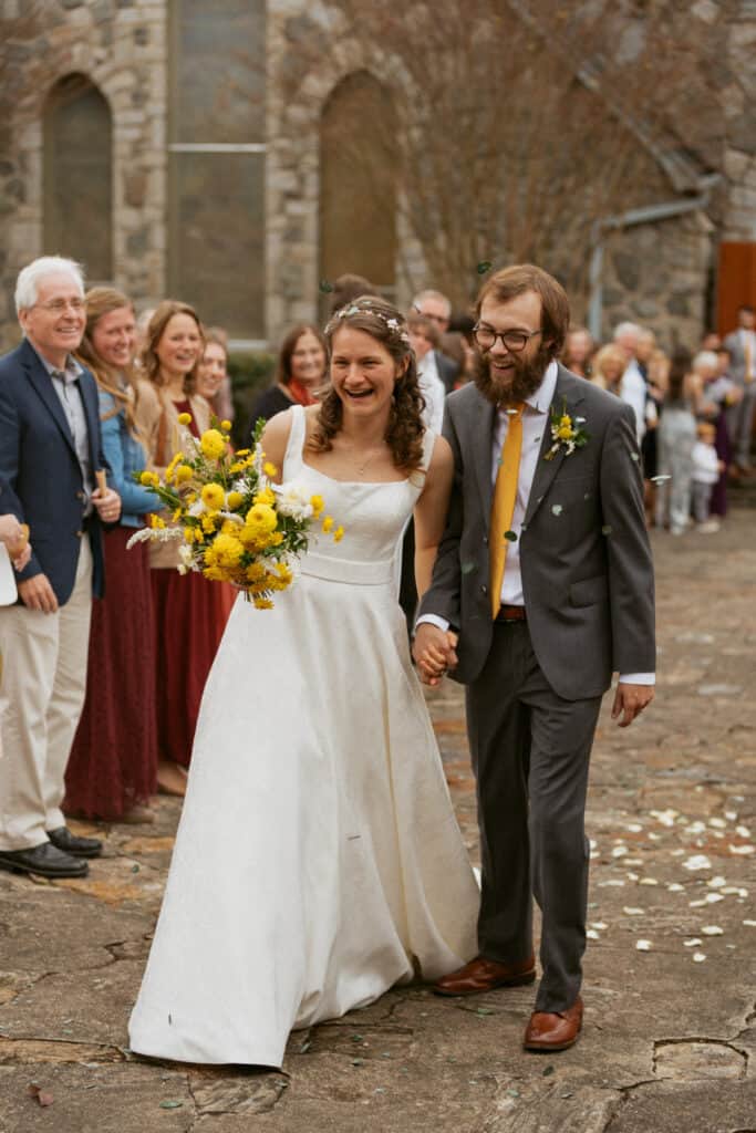 bride and groom walking down the aisle after ceremony at asheville wedding venue